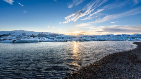 Beautiful view of icebergs in Jokulsarlon glacier lagoon at sunset, Iceland, global warming concept, selective focusの写真素材