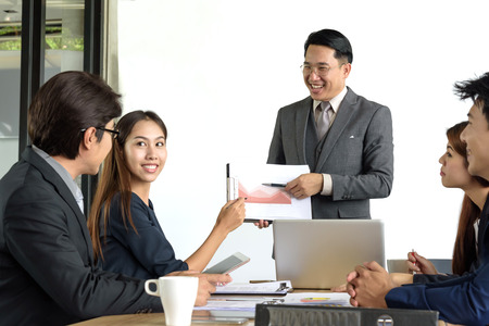 asian professional businessman present financial chart with team in the meeting, selective focusの写真素材