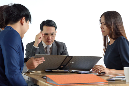 young businesspeople, man and woman, look for business project in the meetingの写真素材