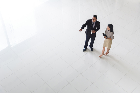 Top view, Asian business people, man and woman, talking about ideas, copy space, selective focusの写真素材