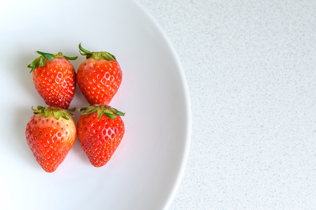 Strawberry on the plate with copy space, selective focusの写真素材