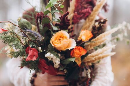 Wedding floristry in a yellow autumn meadow.