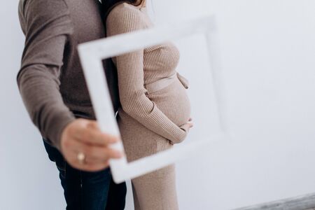 Young parents expecting a baby. Healthy family.の写真素材