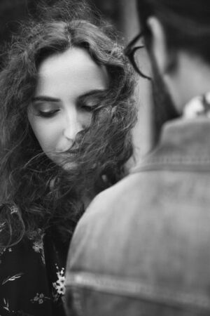 Girlfriend and boyfriend put on a casual walk in a field with yellow grass.の写真素材