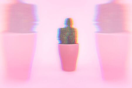 Background. Green cactus on a pink background in a pink pot. Abstraction.の写真素材