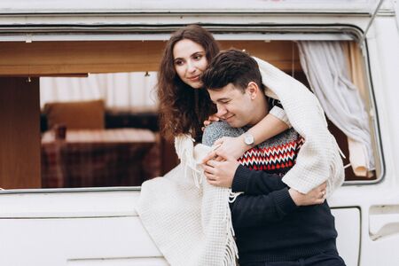 Loving couple alone in a trailer on a trip. Romance for lovers.の写真素材