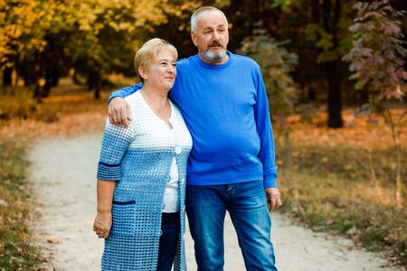 Pensioners walk in the park. Happy old age.