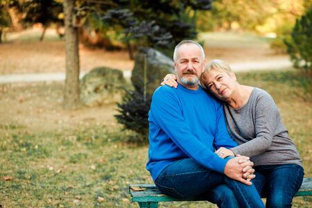 Elderly couple walks in the park. Happy old age.の写真素材