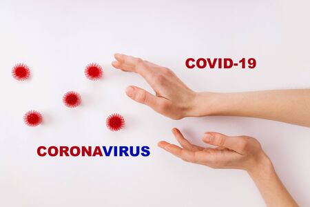 The concept of coronavirus quarantine. New Coronavirus COVID 19. Hands reach for coronovirus. Clean hands fights coronavirus COVID-19. Pandemic 2019-2020.の写真素材