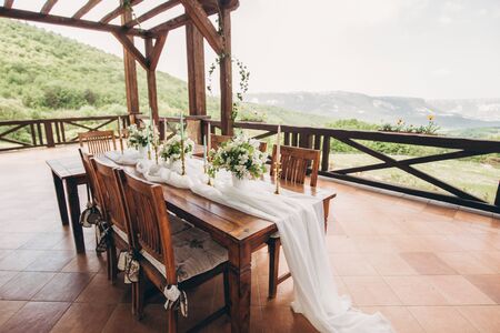 Decorated wedding table for the newlyweds and guests. Wedding decor and Floristics.の写真素材