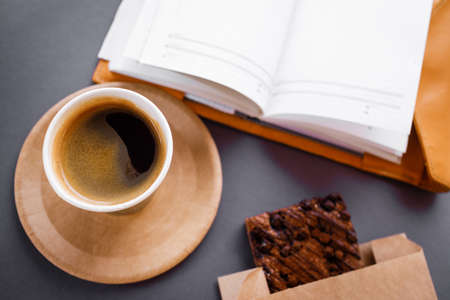 Black strong morning coffee in eco paper cups. Freelance work.の写真素材