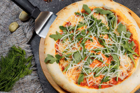 Pizza with bacon, tomatoes, cheese and olives. Italian Cuisine.の写真素材