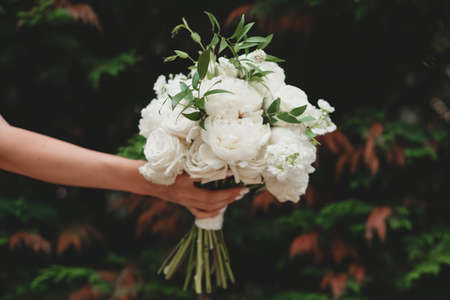 White bridal bouquet of peonies and roses. Scenery for the wedding.の写真素材