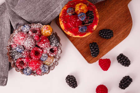 Fresh cake with raspberries in powdered sugar. Dessert in a cafe for breakfast.の写真素材