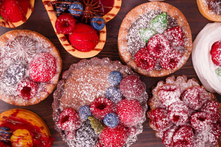 Fresh cake with raspberries in powdered sugar. Dessert in a cafe for breakfast.の写真素材