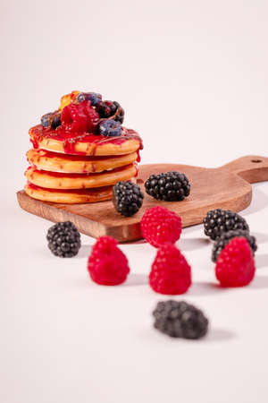 Fresh cake with raspberries in powdered sugar. Dessert in a cafe for breakfast.の写真素材