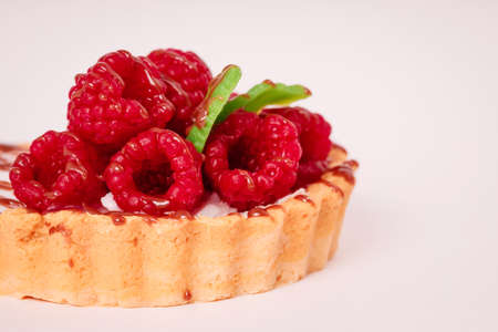 Fresh cake with raspberries in powdered sugar. Dessert in a cafe for breakfast.の写真素材