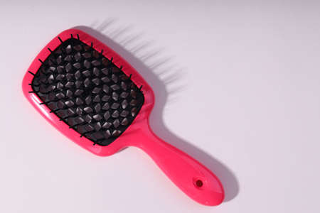 Bright hair brush an white background.の写真素材