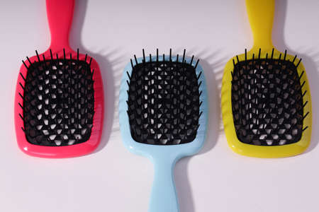 Bright hair brush an white background.の写真素材