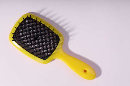 Bright hair brush an white background.の写真素材