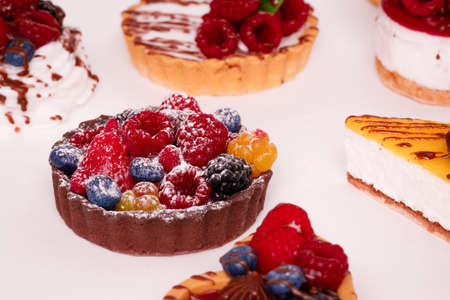 Fresh cake with raspberries in powdered sugar. Dessert in a cafe for breakfast.の写真素材