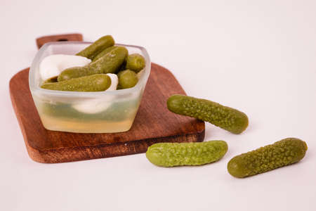 Pickles cucumbers with garlic on a white plate. Russian menu.の写真素材