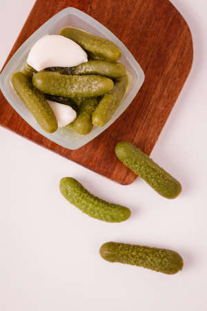 Pickles cucumbers with garlic on a white plate. Russian menu.の写真素材