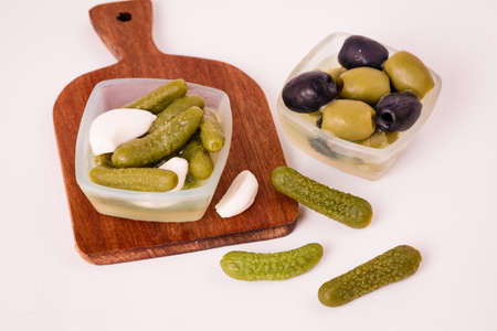 Pickles cucumbers with garlic on a white plate. Russian menu.の写真素材