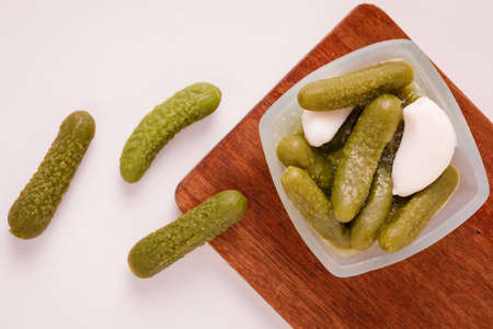Pickles cucumbers with garlic on a white plate. Russian menu.の写真素材