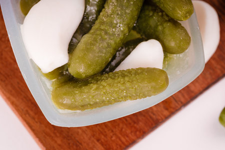 Pickles cucumbers with garlic on a white plate. Russian menu.の写真素材