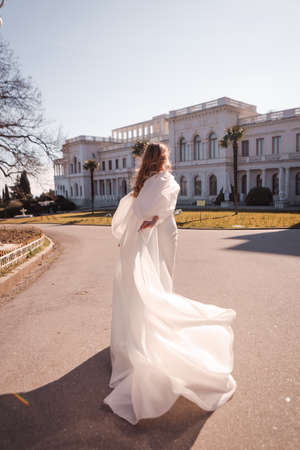 Long flowing wedding dress of the bride.の写真素材