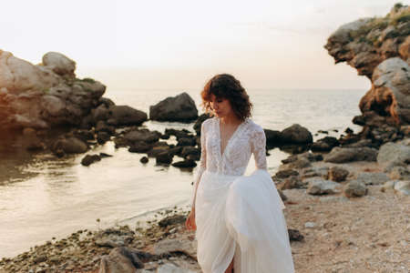 Beautiful stylish bride in a white dress. wedding in boho style.の写真素材