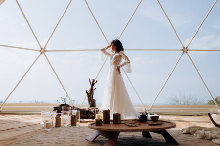Beautiful stylish bride in a white dress. wedding in boho style.の写真素材