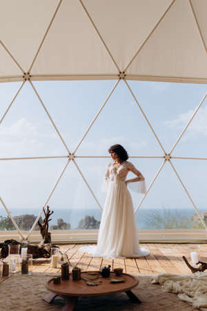 Beautiful stylish bride in a white dress. wedding in boho style.の写真素材
