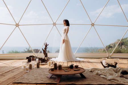 Beautiful stylish bride in a white dress. wedding in boho style.の写真素材