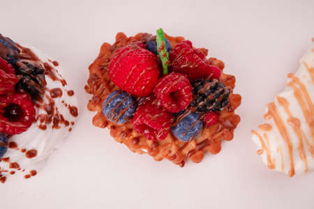 Fresh cake with raspberries in powdered sugar. Dessert in a cafe for breakfast.の写真素材