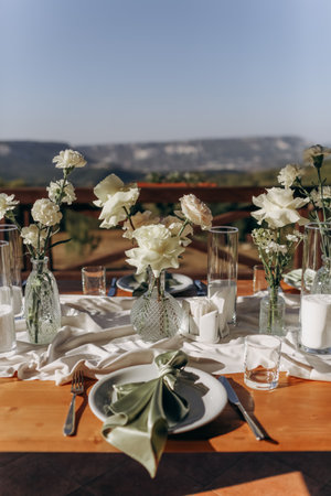 The wedding table decorated with fresh flowers.の写真素材