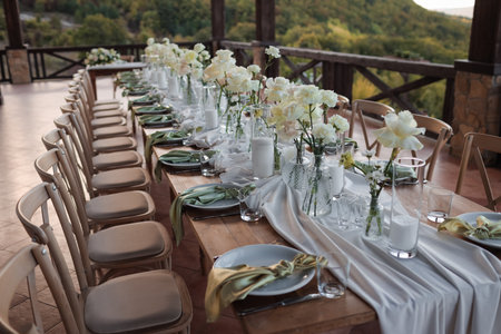 The wedding table decorated with fresh flowers.の写真素材