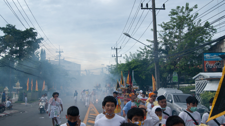 PHUKET TOWN - OCT 7: A photo of people in parade, known locally as the Phuket Vegetarian Festival, on Oct 7, 2016 in Phuket Town, Thailand.のeditorial素材
