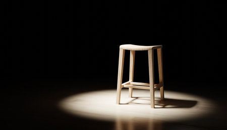 Modern stool isolated on Dark background. Modern wooden object. Omni light. Dramatic sceneの写真素材