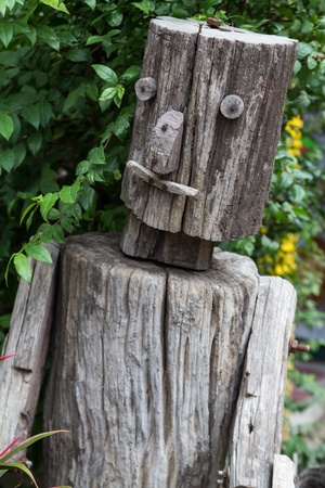 Wooden puppet in gardenの写真素材