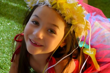 A pretty little girl dressed up as fairy flowerの写真素材