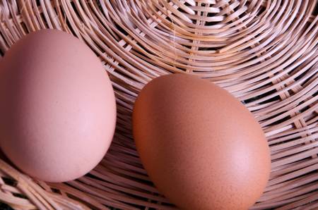 2 eggs in a basketの写真素材