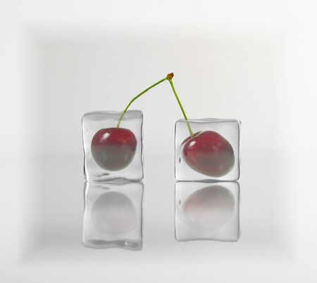 Cherry frozen in ice cubeの写真素材