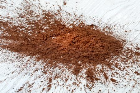 Sprinkled cocoa powder on wood tableの写真素材