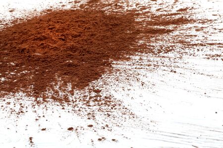 Sprinkled cocoa powder on wood tableの写真素材