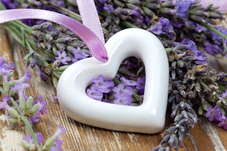 White heart on wooden tableの写真素材