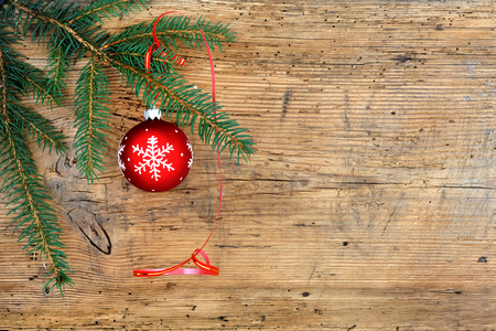 Red christmas ball on wooden backgroundの写真素材