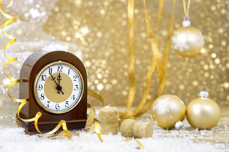 Happy New Year. Old clock on yellow abstract backgroundの写真素材
