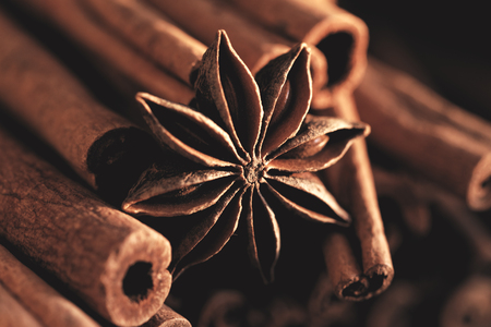 Cinnamon sticks and star anise on a wooden tableの写真素材